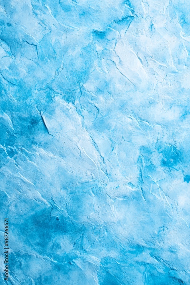 Obraz premium A tight shot of a blue-tinted ice chunk with white streaks, suggesting melting