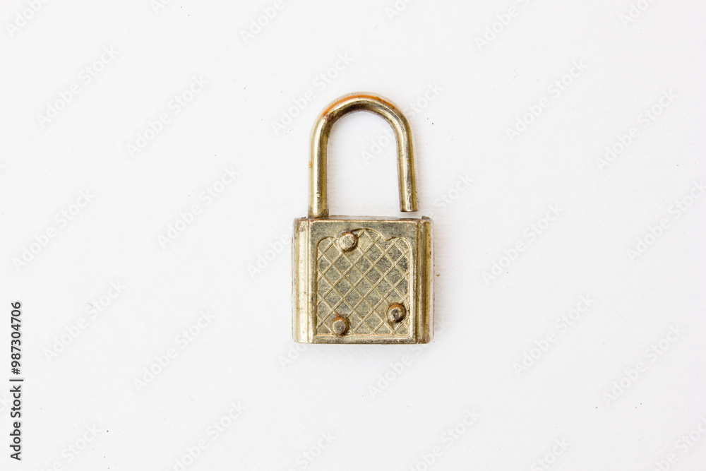 A textured silver padlock. This padlock is very strong to protect valuables that are in a place. A textured silver padlock. This padlock is very strong to protect valuables that are in a place.