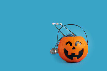 halloween medical healthcare,stethoscope in a pumpkin candy bowl, seasonal discounts for doctors in hospitals and clinics, autumn examinations, holiday promotions