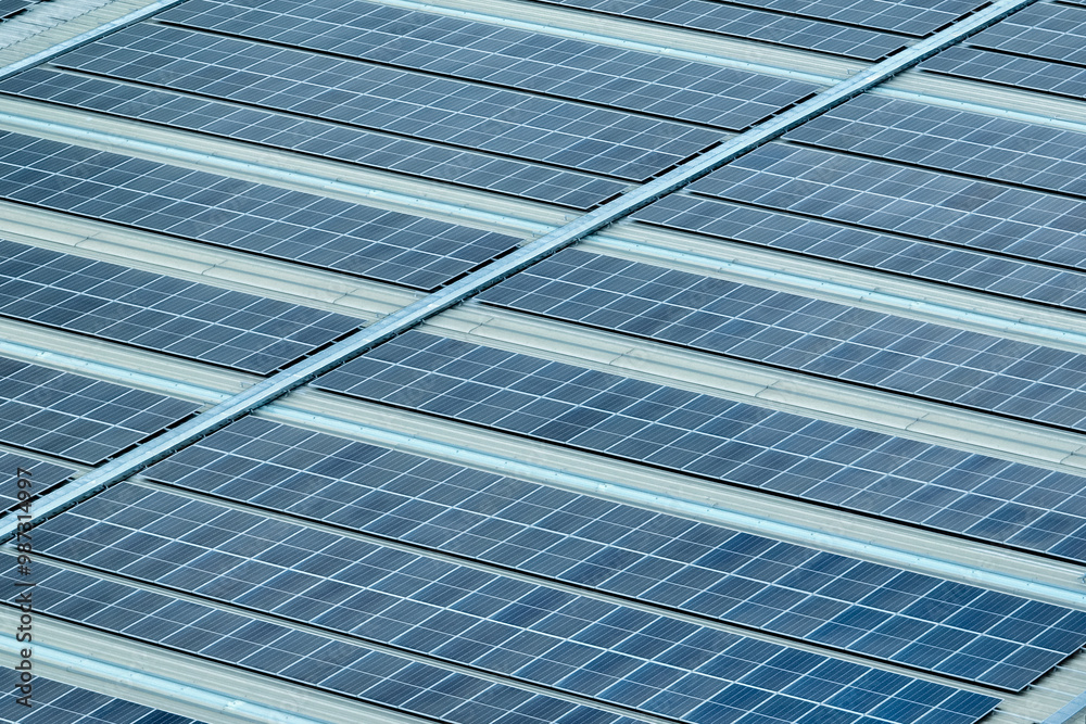 Solar energy for factory and warehouse building. Solar panels on roof of industrial plant. Commercial solar power. Rooftop solar power. Rooftop renewable energy system. Sustainable green energy. Solar energy for factory and warehouse building. Solar panels on roof of industrial plant. Commercial solar power. Rooftop solar power. Rooftop renewable energy system. Sustainable green energy.