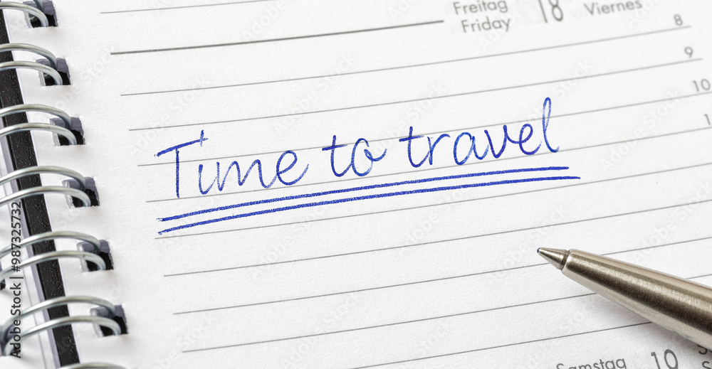Time to travel written on a calendar page Time to travel written on a calendar page