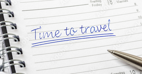 Time to travel written on a calendar page