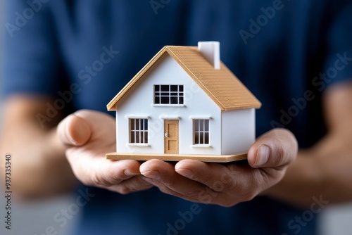 Investor examining model house, symbolizing real estate opportunities, business growth