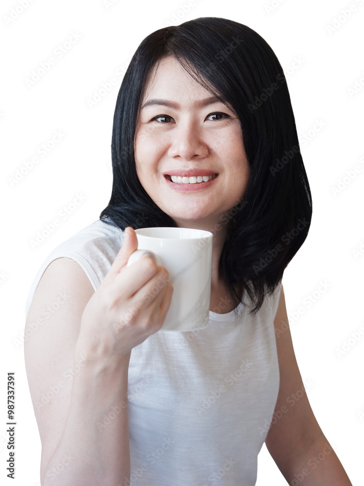 Smiling Asian businesswoman in white t-shirt is relaxing and drinking a cup of hot coffee Smiling Asian businesswoman in white t-shirt is relaxing and drinking a cup of hot coffee