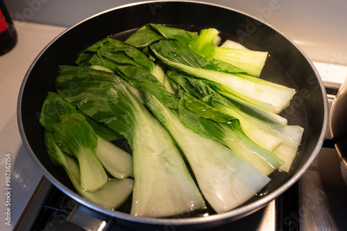 Fotografie Bok choy blanching in the hot water.