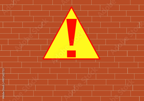 Warning sign, caution on brick wall.