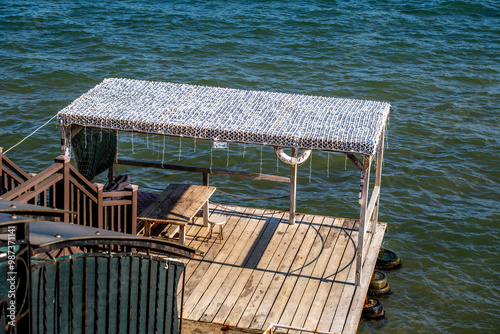 Wooden pier for boats at sea. photo