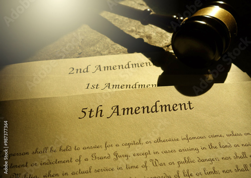 Photos First, Second and Fifth Amendments to the US Constitution and court gavel -- civ