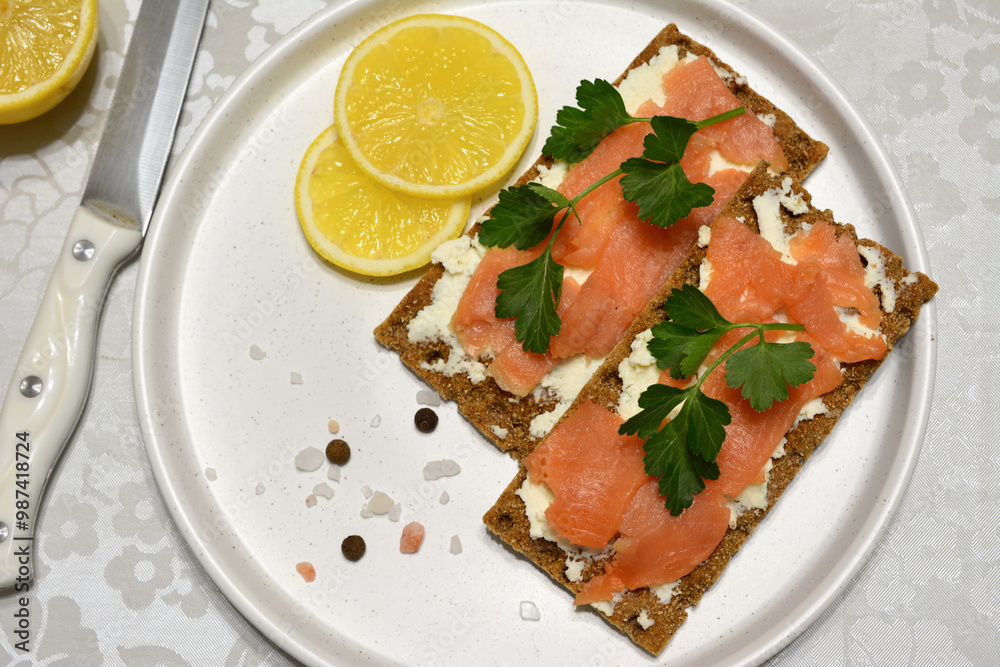 a crispbread sandwich with cream cheese and salmon slices top view a crispbread sandwich with cream cheese and salmon slices top view