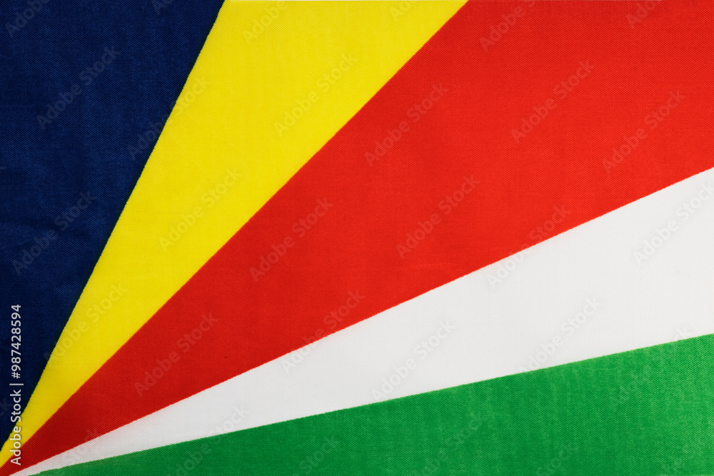 National flag of the state of Seychelles close-up. State background. National flag of the state of Seychelles close-up. State background.