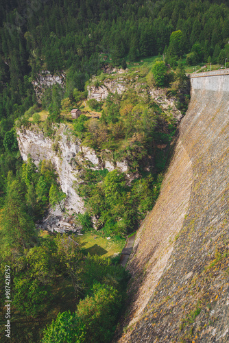 Dike at Pontechianale in Val Varaita, Italy, 2023. Wall of the dike at Pontechianale.  photo