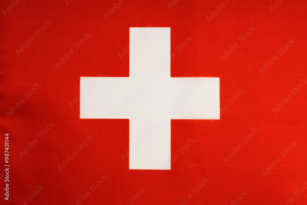 Fototapeta premium National flag of the state of Switzerland close-up. State background.