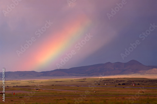 rainbow over the mountains of Prescott Arizona with a stormy monsoon sky background