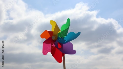 Spring blue sky and white clouds with windmills turning in the wind 4k