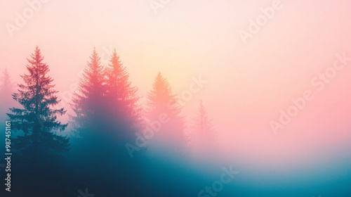 Misty sunrise in the forest with a soft pink and blue sky.