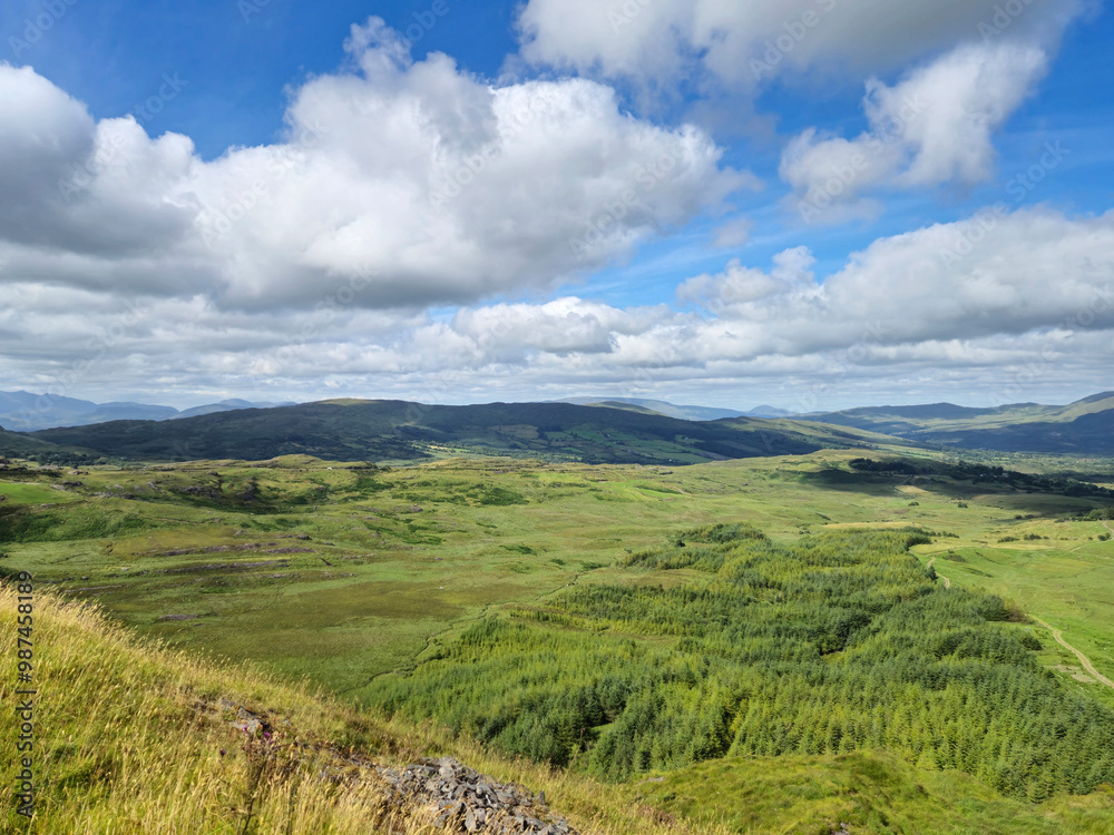 Fototapeta premium Green hills under blue summer sky landscape in Ireland
