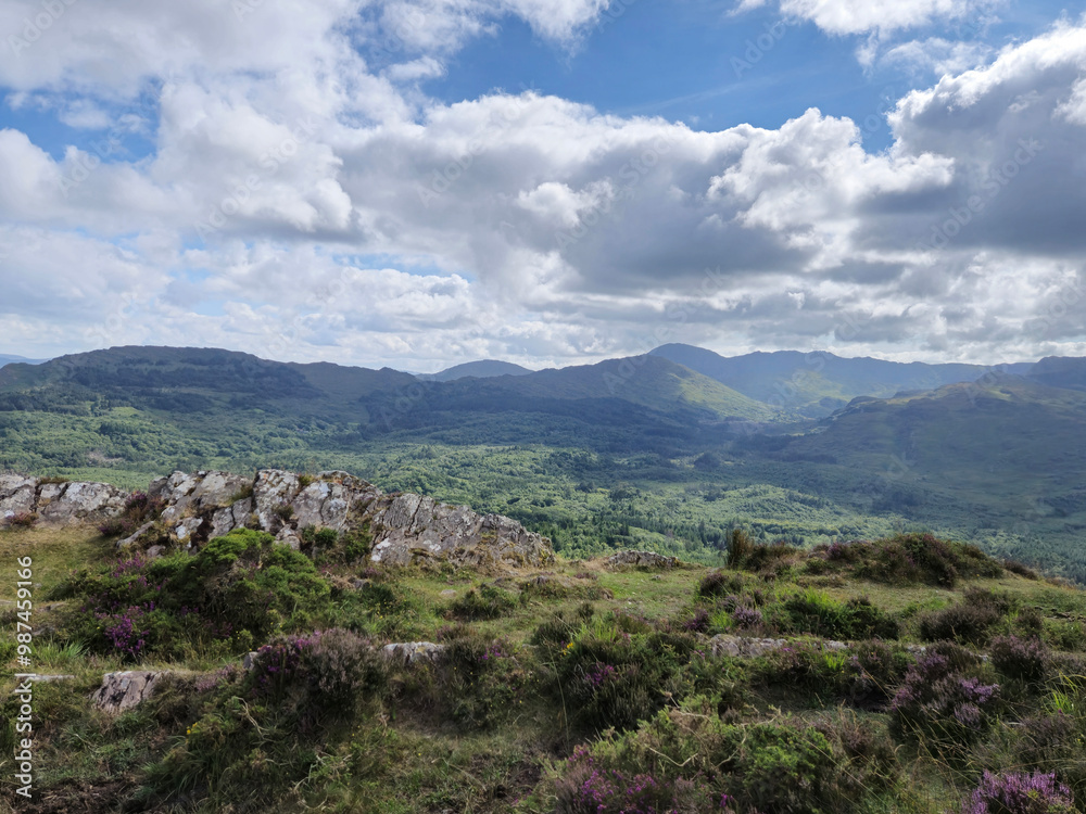 Green hills under blue summer sky landscape in Ireland Green hills under blue summer sky landscape in Ireland