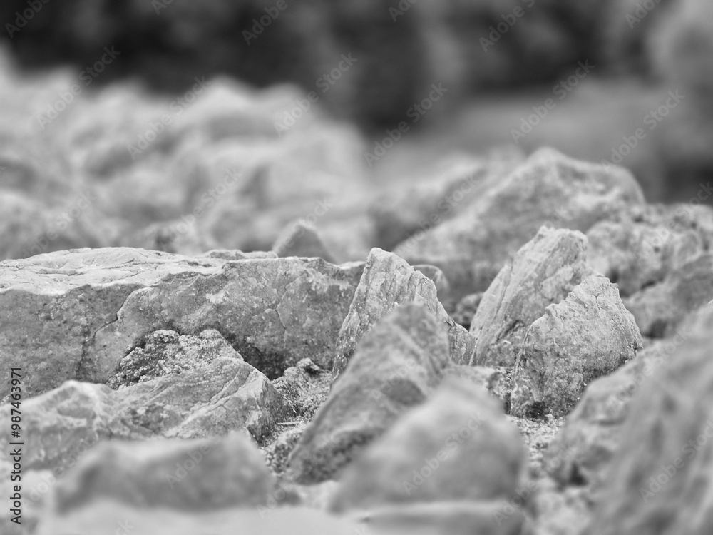 Stones pile close macro view with blurred bokeh black and white monochrome photo background Stones pile close macro view with blurred bokeh black and white monochrome photo background