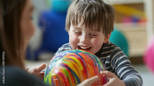 Happy Child Playing with Colorful Ball
