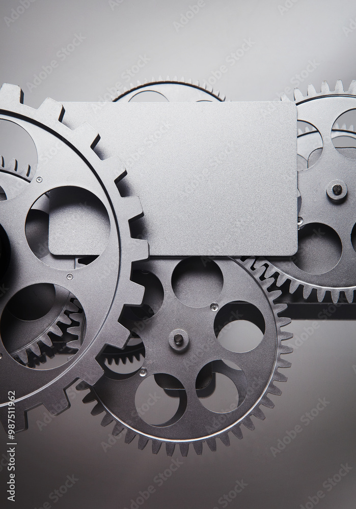 card and gear wheel on a gray background.