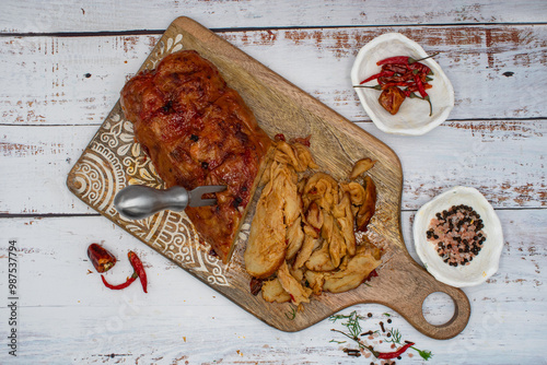 Seitan roast flavored with spices, glazed and served on wooden board photo