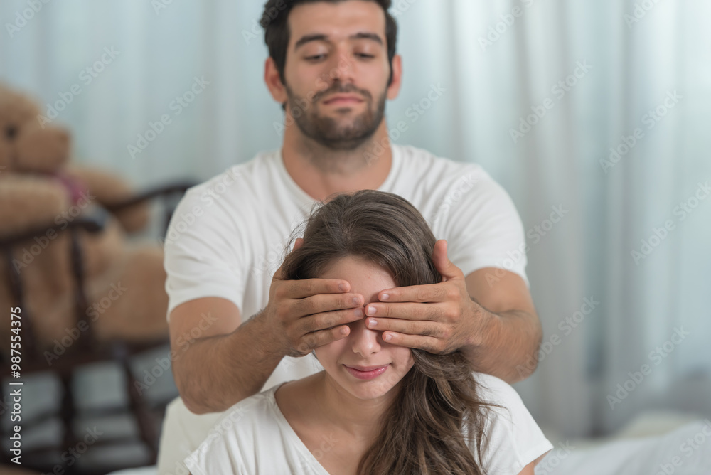 Fototapeta premium Loving couple young man closed his girlfriend eyes