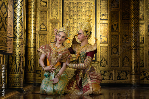 Pantomime (Khon) is traditional Thai classic masked play enacting scenes from the Ramayana with a backdrop of Thai paintings in a public place at Wat Phra Khao, Ayutthaya province, Thailand photo