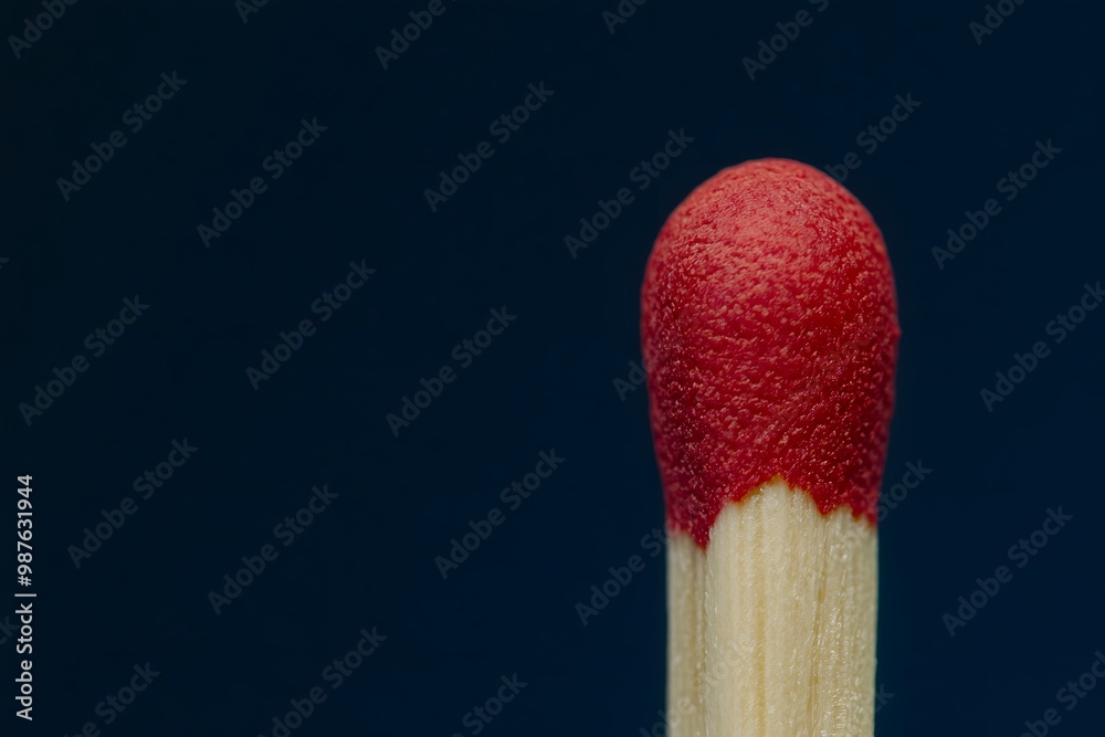 Macro Shot of Matchstick Head with Striking Red Tip on Plain Background Macro Shot of Matchstick Head with Striking Red Tip on Plain Background
