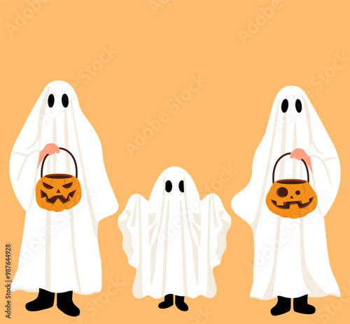Family wearing costumes posing and having fun, holding carved pumpkin