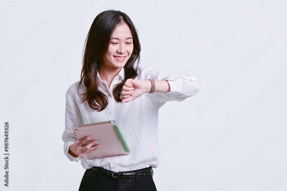 A beautiful Asian model in office clothes. A beautiful Asian model in office clothes.