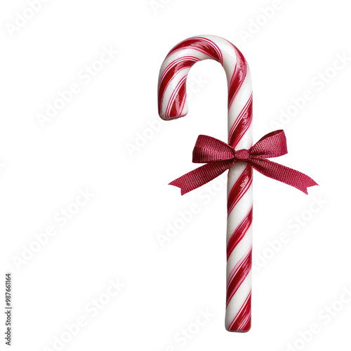 Candy cane with red ribbon on white isolated background photo