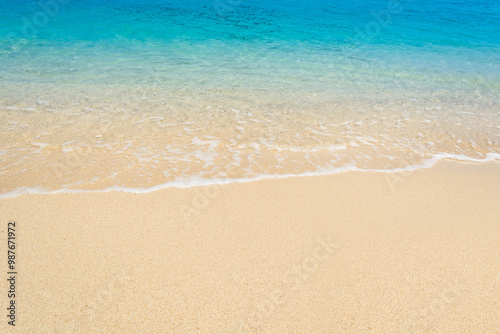 wave on sand beach top view.