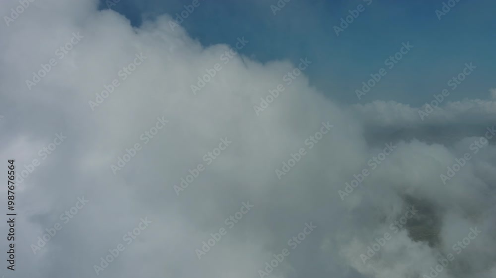 Flying through beautiful white fluffy clouds in blue sky. Airplane travel background, 4k Flying through beautiful white fluffy clouds in blue sky. Airplane travel background, 4k
