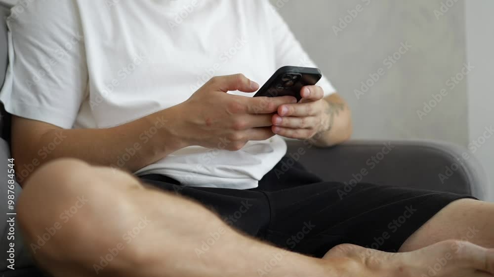A man holds a smartphone in his hands.
Man with a phone.
A black phone is in the hands of a young guy.
A man looks at the phone screen.
Phone, smartphone, gadget, sensor, black, modern A man holds a smartphone in his hands.
Man with a phone.
A black phone is in the hands of a young guy.
A man looks at the phone screen.
Phone, smartphone, gadget, sensor, black, modern