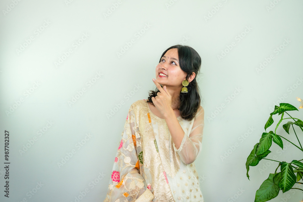 Beautiful Asian Female in Kurtha for Diwali giving Expressions & Gestures with LED Christmas Lights Beautiful Asian Female in Kurtha for Diwali giving Expressions & Gestures with LED Christmas Lights