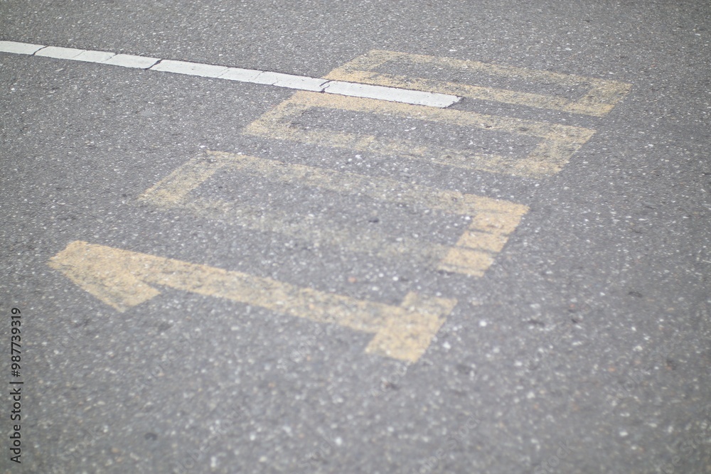 Fototapeta premium Directional marking on asphalt road, showing 'LEFT' with arrow pointing left