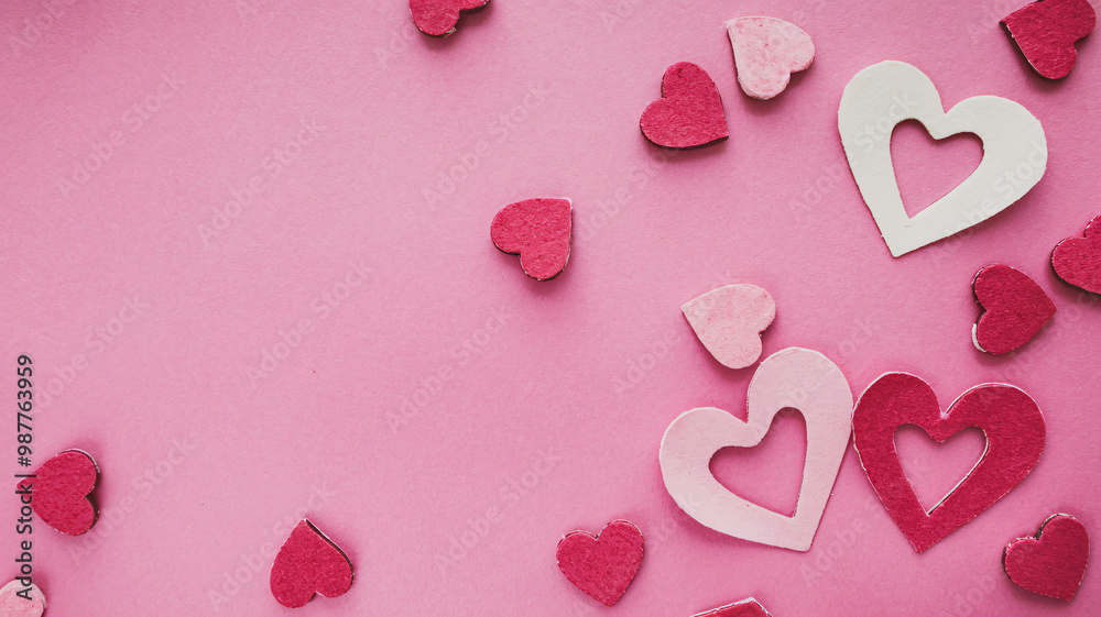 Obraz premium Paper Hearts Scattered on Pink Background