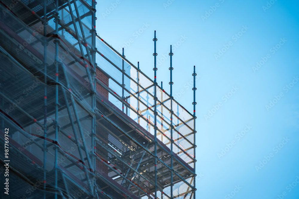 Scaffold sheeting net wrapped apartments building during insulation in england uk Scaffold sheeting net wrapped apartments building during insulation in england uk
