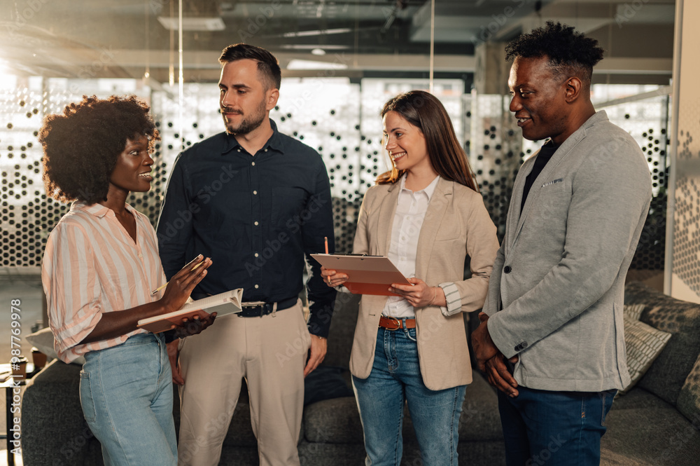 Diverse businesswoman explaining innovative ideas to her team of experts