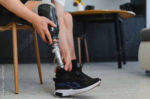 portrait of man with prosthetic leg sitting
