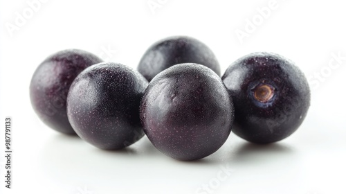 Fresh Acai Berries with Deep Purple Color and Smooth Surface on White Background