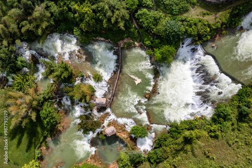 Aerial landscape in Quay Son river, Trung Khanh, Cao Bang, Vietnam with nature, green rice fields and rustic indigenous houses photo