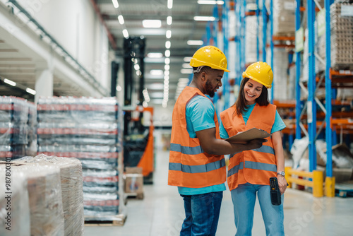 Konstfotografi Diverse warehouse staff reviewing inventory data with technology support