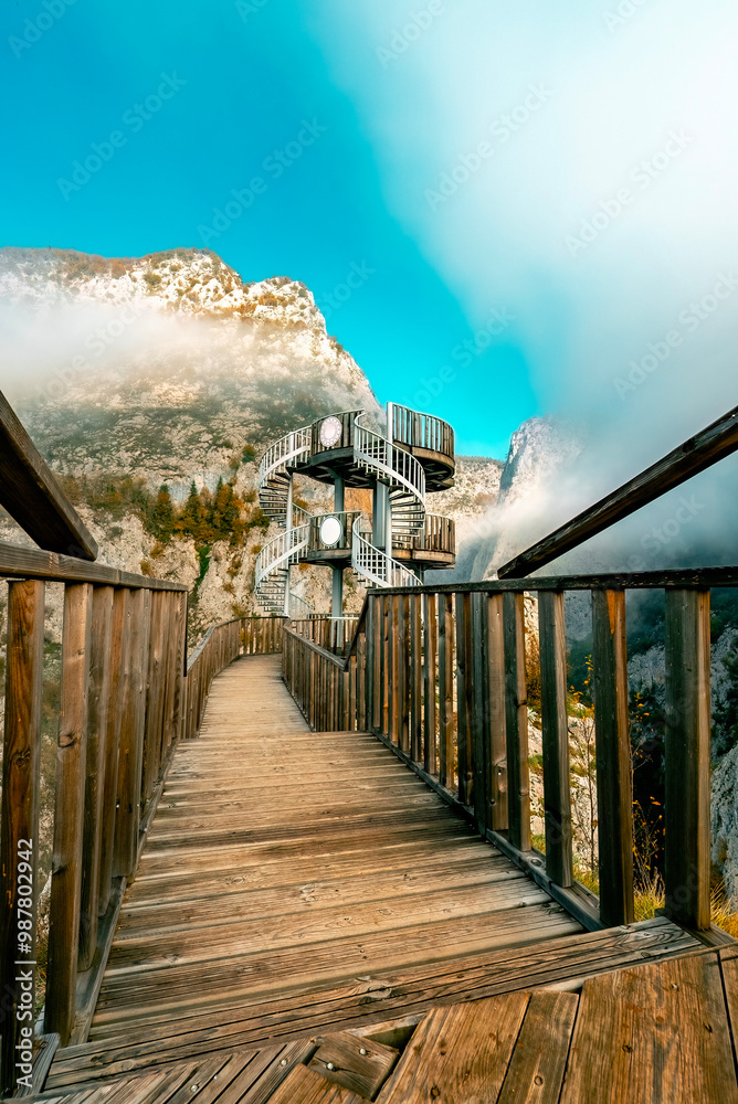 Obraz premium Valla Canyon located between the mountains. Magnificent Valla Canyon with fog and autumn trees.