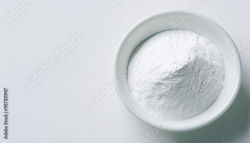 White zinc oxide powder in bowl on white table. Healthcare and medical supplement product.