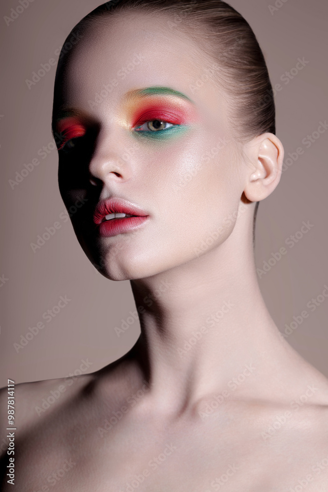 Young sensual woman with clear glowing skin and pink green makeup Young sensual woman with clear glowing skin and pink green makeup