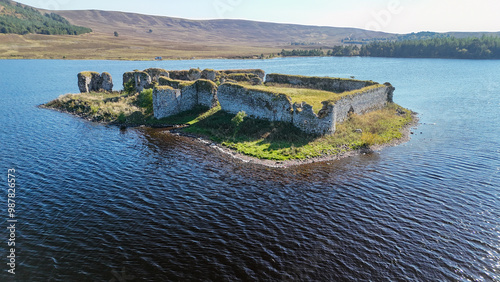 Aerial drone shot of Lochindorb castle on its own island in the middle of the water photo