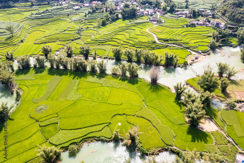 Aerial landscape in Quay Son river, Trung Khanh, Cao Bang, Vietnam with nature, green rice fields and rustic indigenous houses. photo