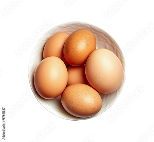 Fresh brown eggs nestled in a white bowl