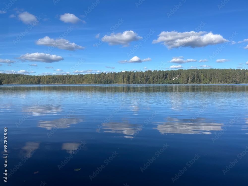 Fototapeta premium beautiful blue lake view, blue sky with white clouds reflections on the lake surface